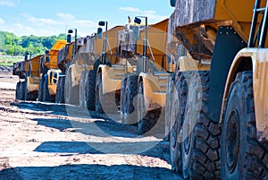 Row of dump trucks