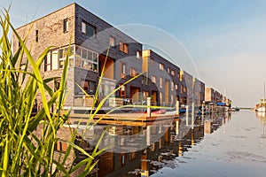 Row of Dutch modern canal houses in Almere photo