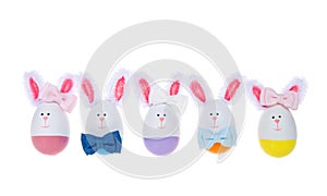 Row of Easter Eggs crafted into bunnies, boys and girls, wearing bow ties isolated