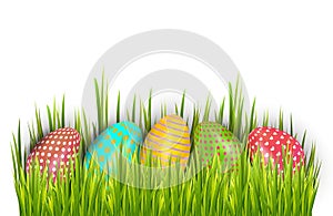 Row of Easter painted eggs hidden in green grass and isolated on white background. Vector illustration.