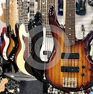 Row of electric guitars on display