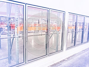 Row of empty commercial fridges at wholesale big-box store