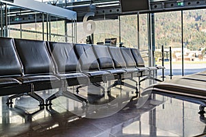 Row of empty seats at an airport terminal