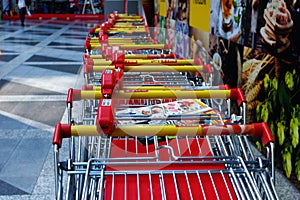 Row of empty shopping carts.