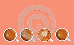 Row of Espresso Coffees with Heart Shaped Latte Art Cappuccino on Pink Background