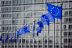 Row of EU Flags in front of the European Union Commission building in Brussels. Belgium - July 30, 2014