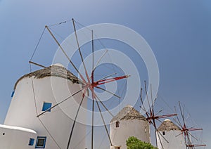 Row of famous Mykonos windmills. Cyclades, Greece