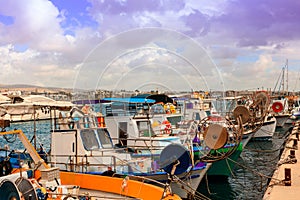 A row of fishing boats in a Cypriot harbor.