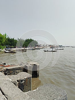 Row of fishing boats on Kenjeran, Surabaya photo