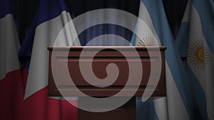 Row of flags of Argentina and France and and speaker tribune, conceptual 3D rendering