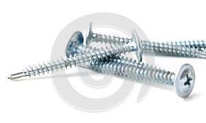 A row of four screws with a pointed top