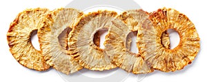 Row of freeze dried pineapple slices photo