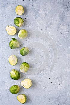 Row of fresh brussels sprouts on gray background
