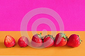 row of fresh strawberries on vibrant colored background,free copy space, Fruit,healthy food,summer concept