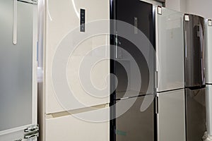 Row of fridges in household appliances store