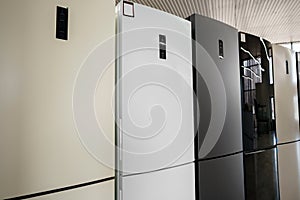 Row of fridges in household appliances store