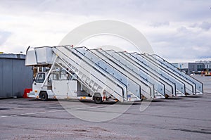 A row of gangways for boarding and alighting passengers from an airplane parked at the airport