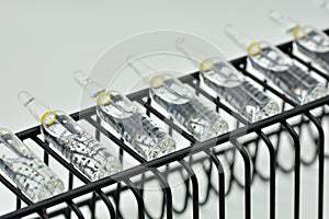 Row of glass ampoules photo