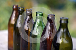 Row of glass colored bottles