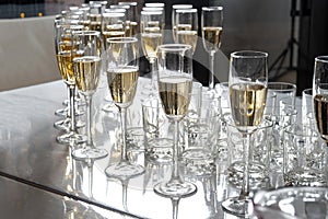 Row of glasses filled with champagne, a beautiful catering party-2.