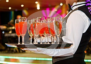 Row of glasses filled with champagne lined up