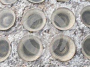 Row of glassy circle bricks in light transmissive ceiling. Safety ceiling