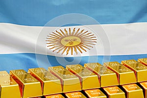 Row of gold bars on the Argentina flag background. Concept of gold reserve and gold fund of Argentina