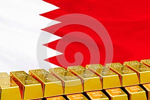 Row of gold bars on the Bahrain flag background. Concept of gold reserve and gold fund of Bahrain