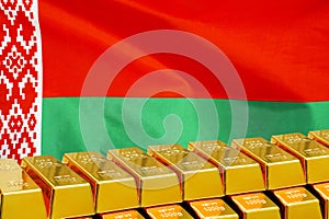 Row of gold bars on the Belarus flag background. Concept of gold reserve and gold fund of Belarus