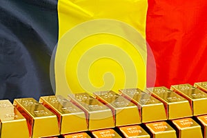 Row of gold bars on the Belgium flag background. Concept of gold reserve and gold fund of Belgium