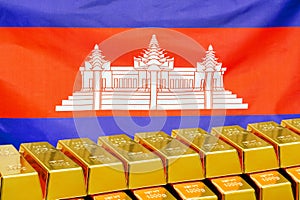 Row of gold bars on the Cambodia flag background. Concept of gold reserve and gold fund of Cambodia