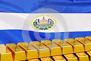 Row of gold bars on the El Salvador flag background. Concept of gold reserve and gold fund of El Salvador