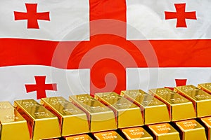 Row of gold bars on the Georgia flag background. Concept of gold reserve and gold fund of Georgia