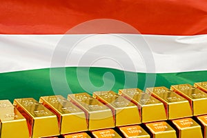 Row of gold bars on the Hungary flag background. Concept of gold reserve and gold fund of Hungary