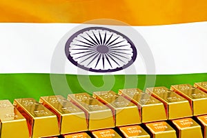 Row of gold bars on the India flag background. Concept of gold reserve and gold fund of India