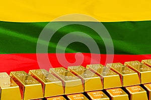 Row of gold bars on the Lithuania flag background. Concept of gold reserve and gold fund of Lithuania