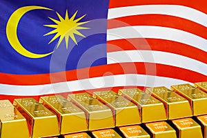 Row of gold bars on the Malaysia flag background. Concept of gold reserve and gold fund of Malaysia