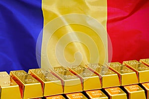 Row of gold bars on the Moldavia flag background. Concept of gold reserve and gold fund of Moldavia