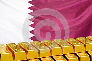 Row of gold bars on the Qatar flag background. Concept of gold reserve and gold fund of Qatar