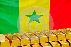 Row of gold bars on the Senegal flag background. Concept of gold reserve and gold fund of Senegal