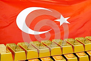 Row of gold bars on the Turkey flag background. Concept of gold reserve and gold fund of Turkey