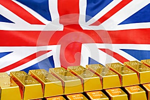 Row of gold bars on the UK flag background. Concept of gold reserve and gold fund of UK