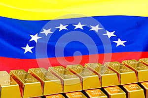 Row of gold bars on the Venezuela flag background. Concept of gold reserve and gold fund of Venezuela