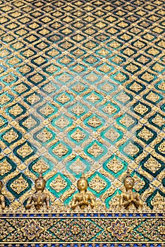 Row of gold giant and fairy on thai temple