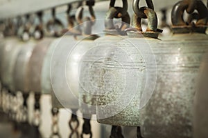 Row of golden bells in buddist temple