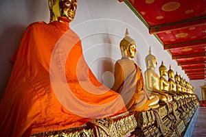 Row of golden buddha statue at Wat Arun, Bangkok Thailand.