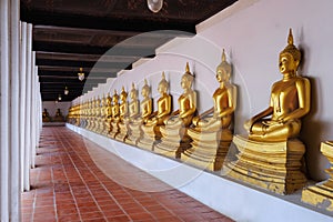 A row of Golden Buddha statue at Wat Phutthaisawan, Ayutthaya, Thailand