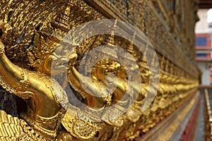 Row of golden Buddha statues