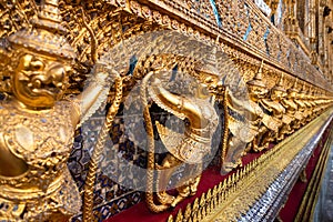 Row of golden garuda scuplture Wat Phra Kaew or the Temple of the Emerald Buddha