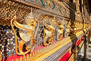 Row of golden garuda scuplture Wat Phra Kaew or the Temple of the Emerald Buddha photo